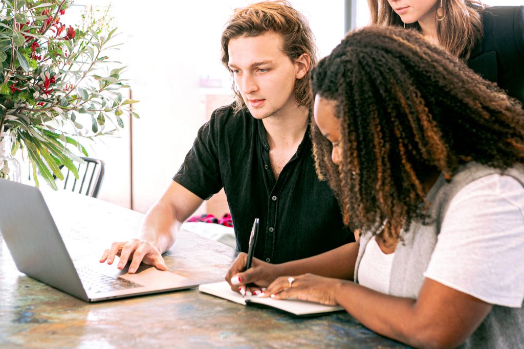 man on laptop grant writing proposal